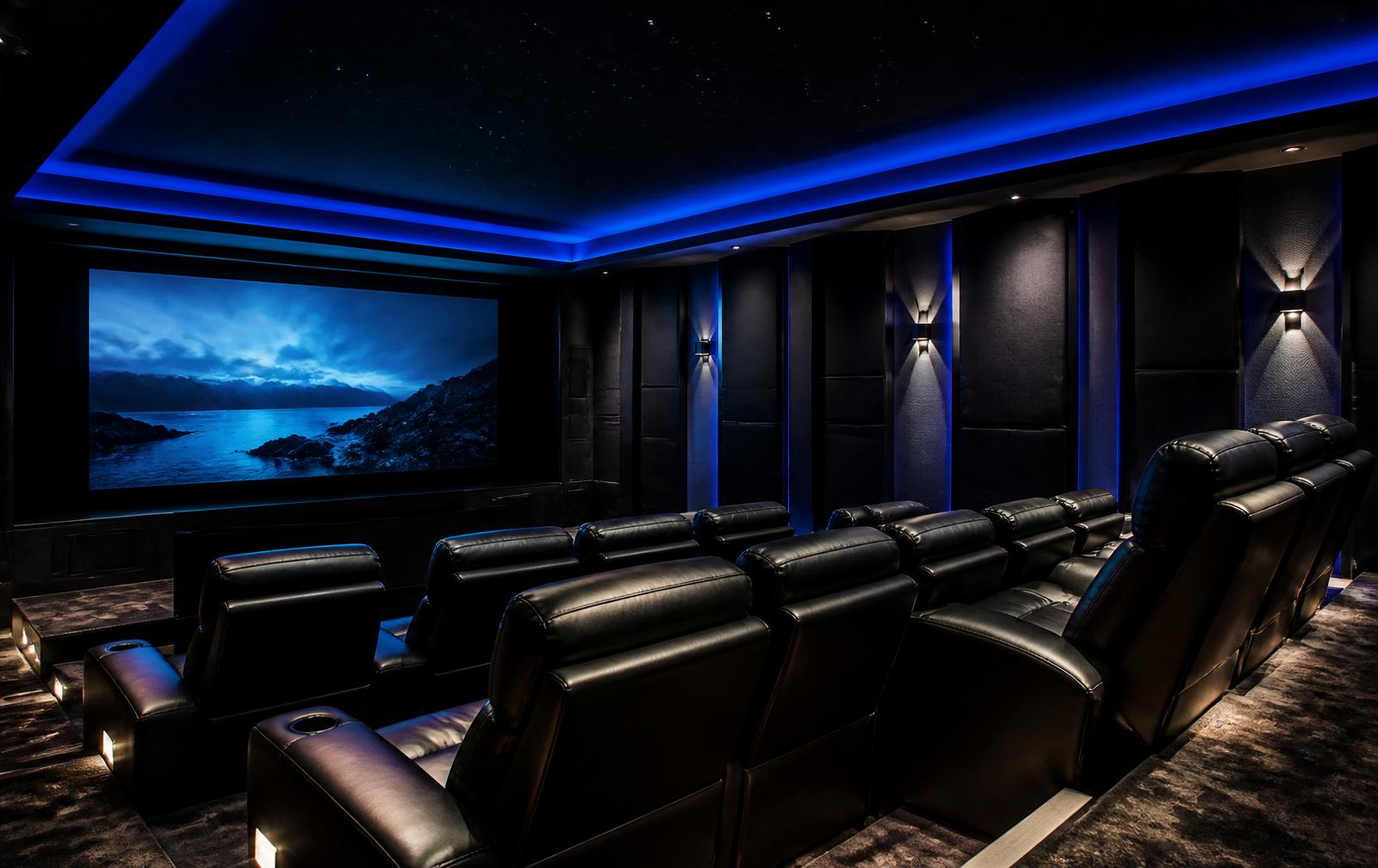 Luxury home theater with tiered leather seating and cove lighting